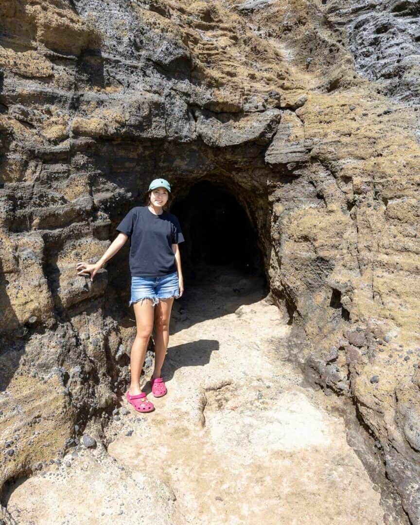 Girl standing in front of Halona Cove lava tube