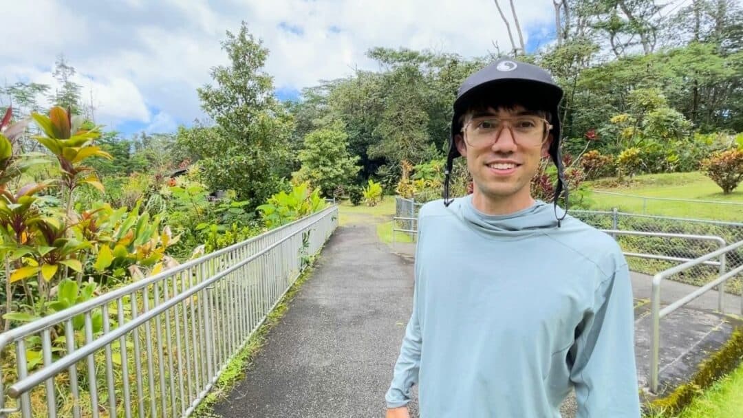 Traveller Trey standing at the entrance to Lava Tree State Monument