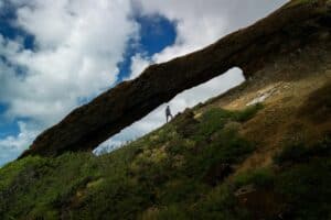 Hiker Standing in Koko Crater Arch