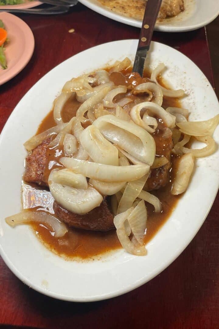 Experiencing Old Hawai‘i: Our Stay at the Historic Manago Hotel 13 The Manago Hotel Restaurant's famous pork chops with onions