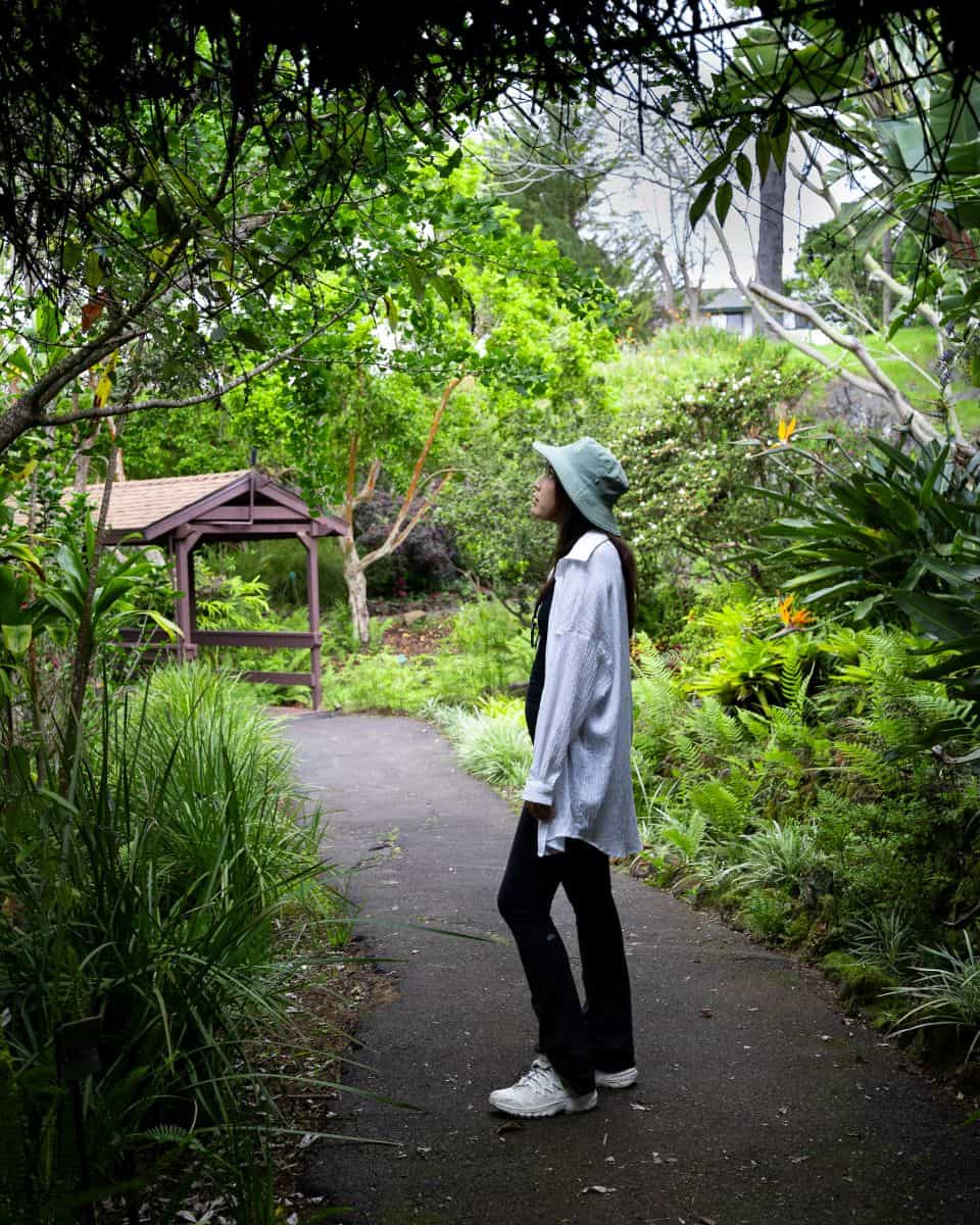 Chloe (The Froggy Adventures) walking through the path at Kula Botanical Gardens