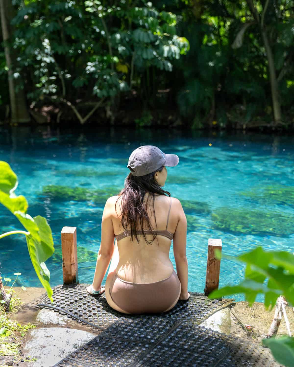 Chloe sitting on the river bank at Las Estacas in Morelos Mexico