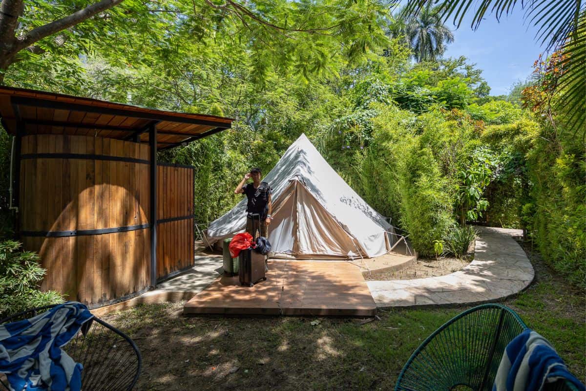 Trey standing outside glamping tent at Las Estacas