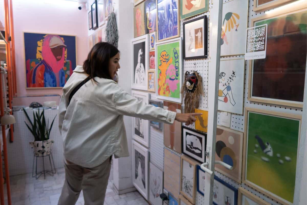 Exploring La Condesa: Things to Do in Mexico City's Trendiest Neighborhood 2 Chloe points out her favorite works at Mooni art gallery!