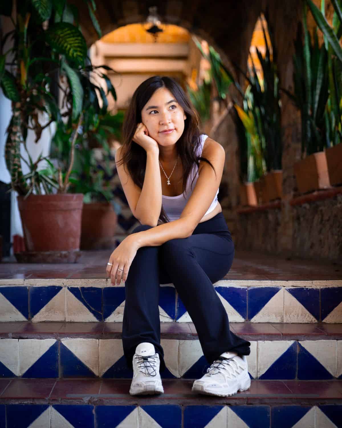 Chloe sitting on the steps of the Hotel De La Misión in Taxco