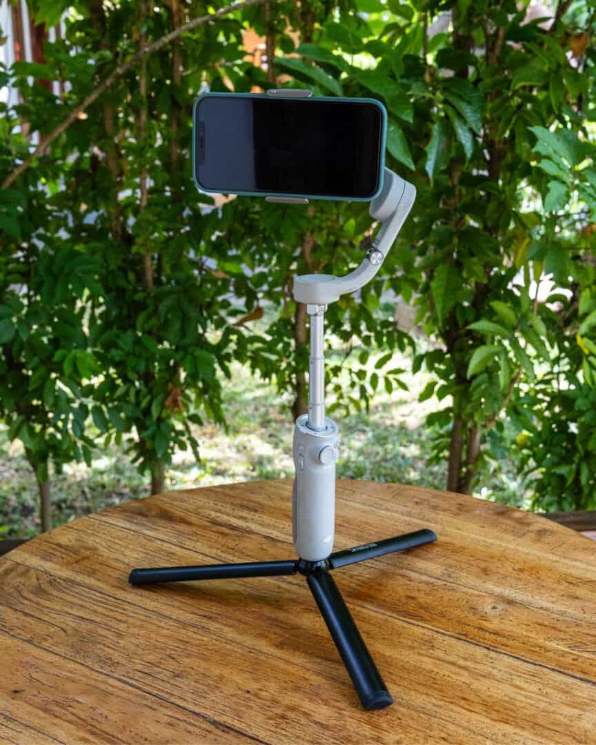 Capture the Journey: The Essential Travel Blogging Camera Gear 11 DJI OM 5 Smartphone Gimbal with Smatree Tripod
