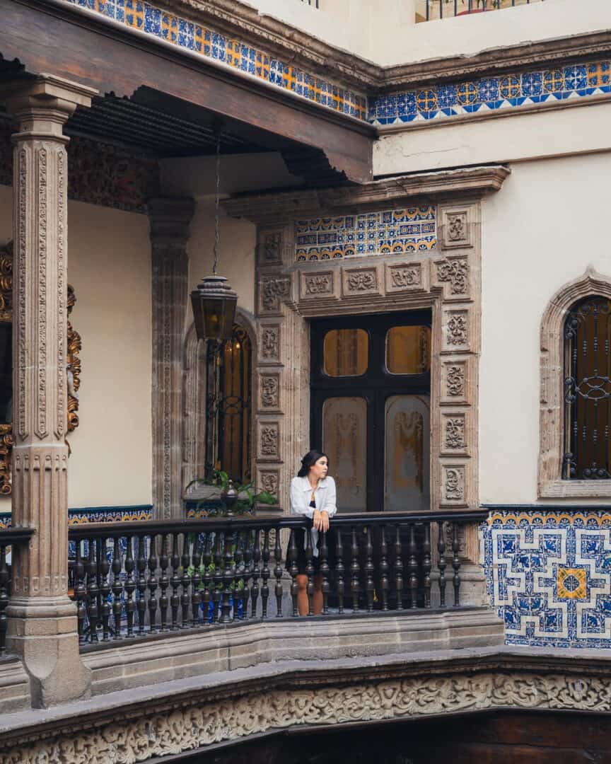 Chloe posing for an Instagram photo at House of Tiles in Mexico City