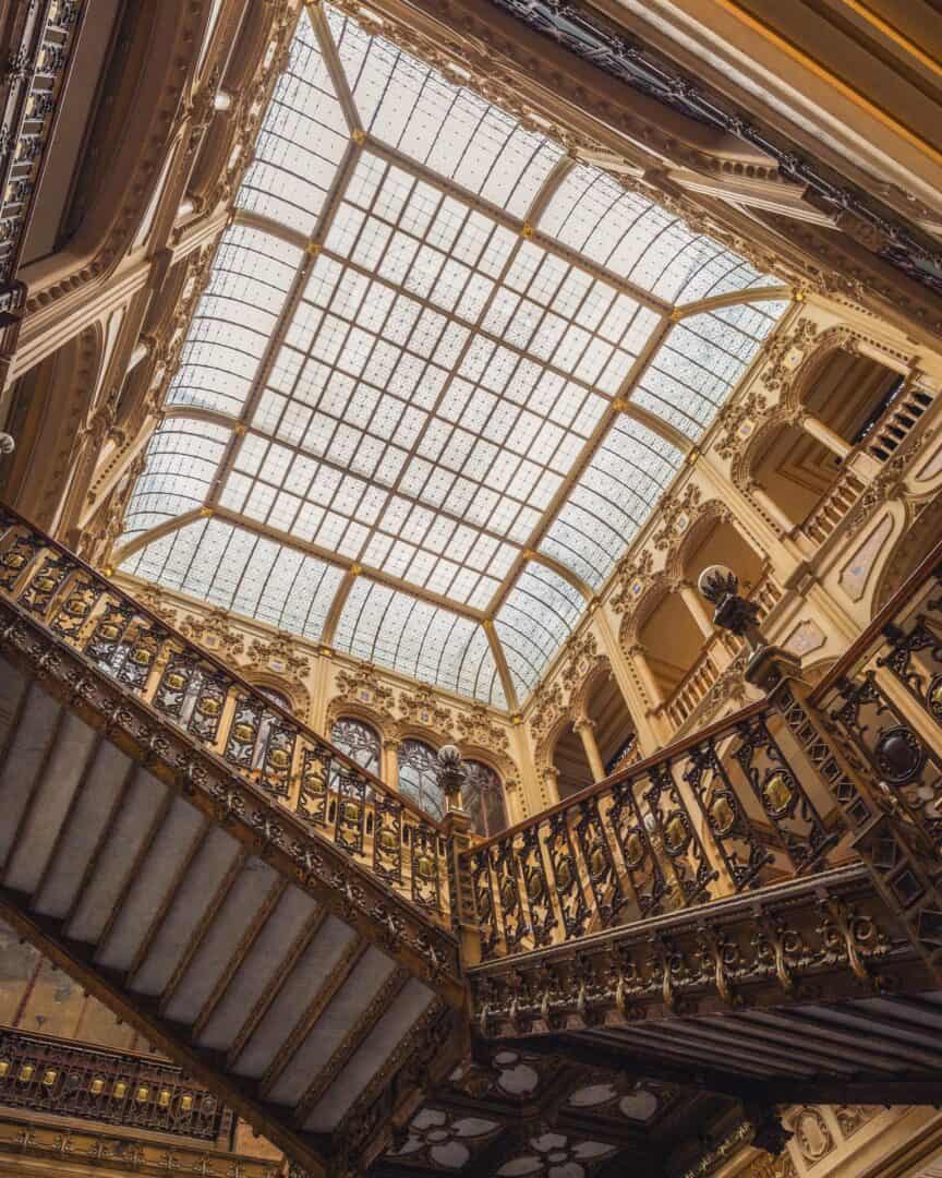 Glass ceiling and golden staircase at Palacio Postal in Mexico City