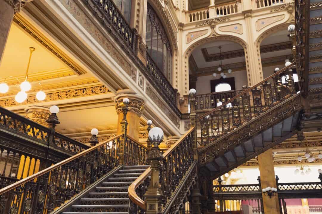Ornate golden staircase at Palacio Postal in Mexico City