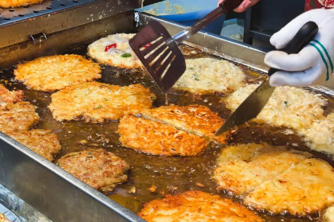 Frying mung bean pancake bindaetteok in Gwangjang Market