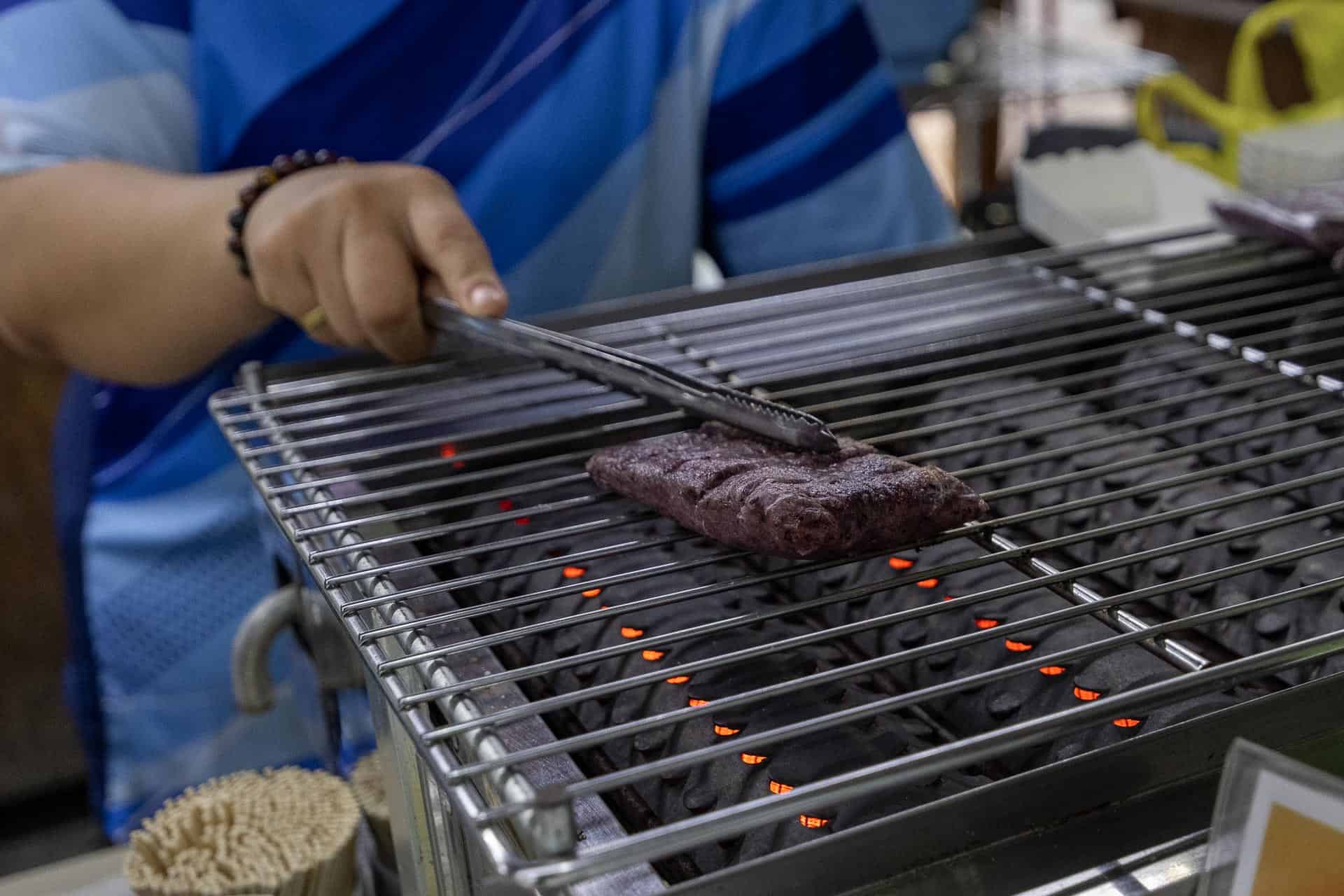 8 Best Things to Do in Taroko Gorge 16 Grilling purple mochi on BBQ at Five Houses on Shakadang Trail