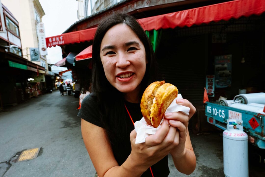 Chloe eating at Ita Thao Market