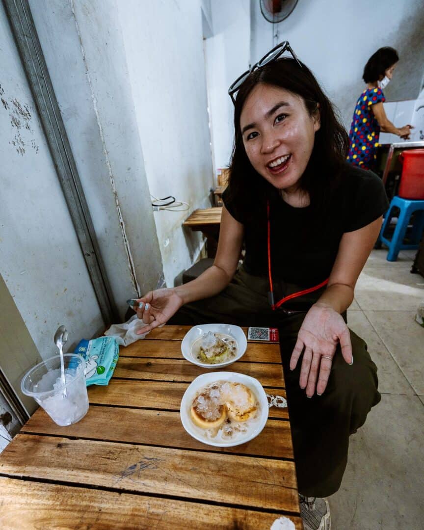 Chloe enjoying flan from Bánh Flan Ngọc Nga