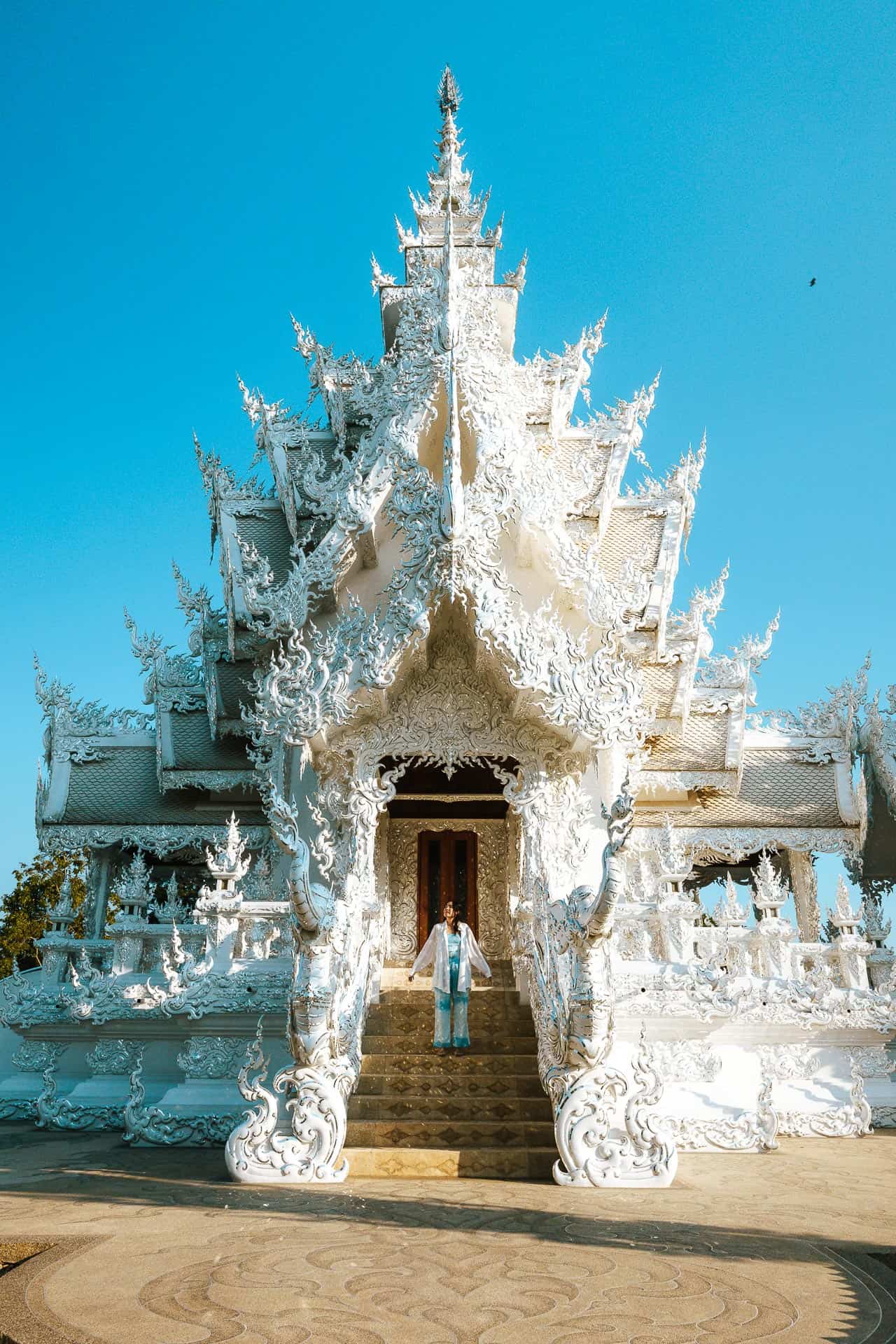 Chloe standing on the steps of White Temple