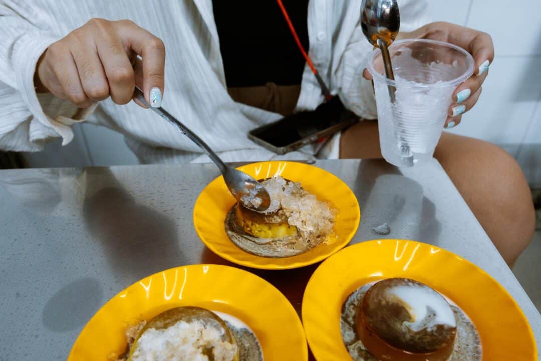 Putting ice on flan at 20 Thuoc Street