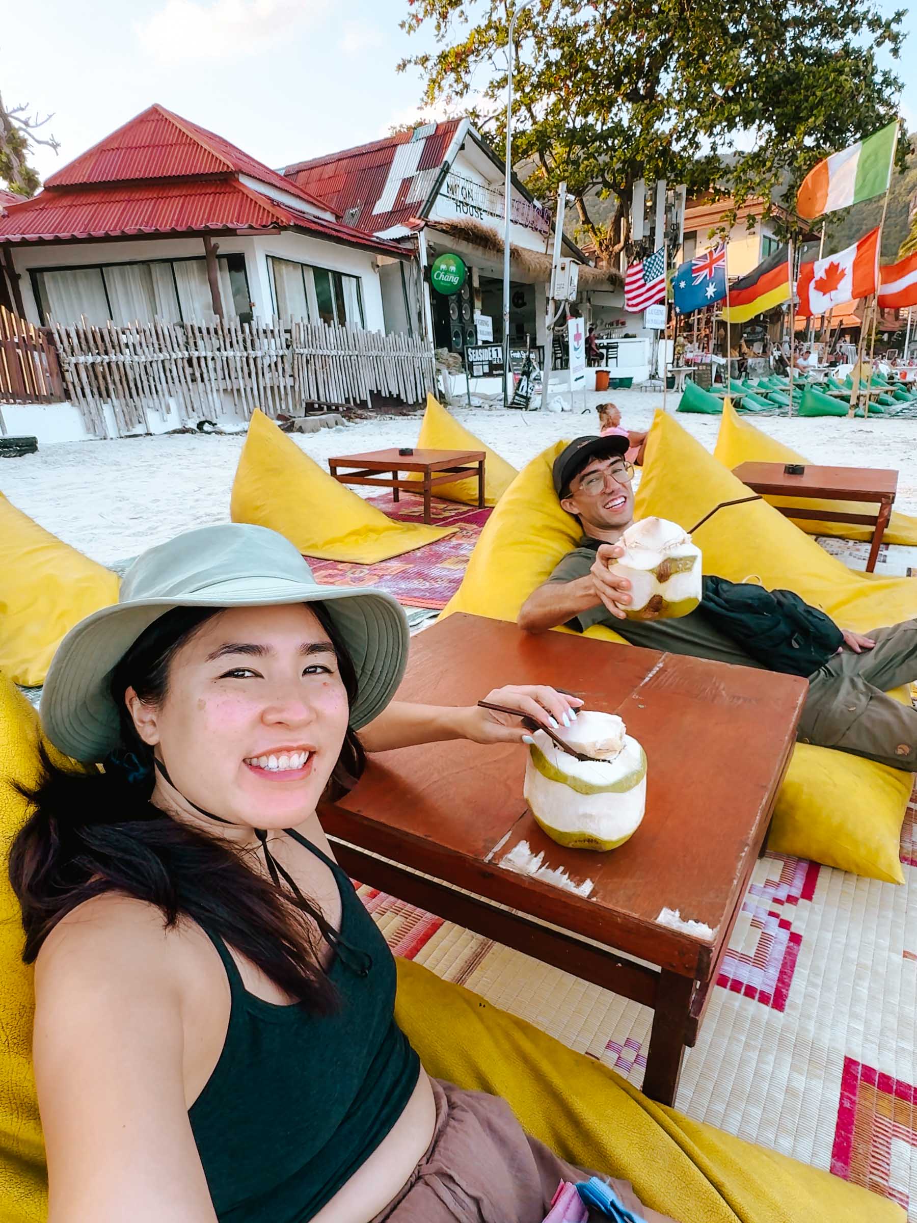 Chloe and Trey drinking coconut at Haad Rin Koh Phangan