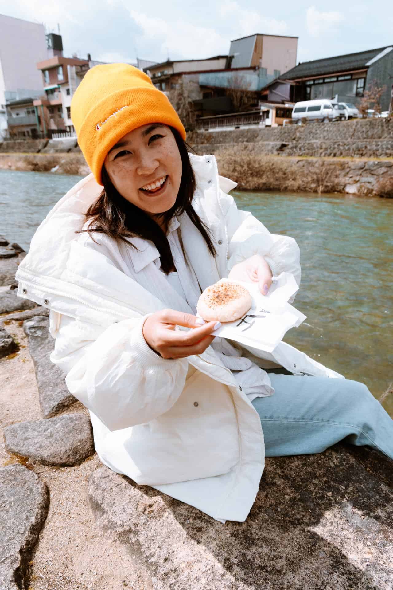 Eating snacks at Miyagawa Morning Market river