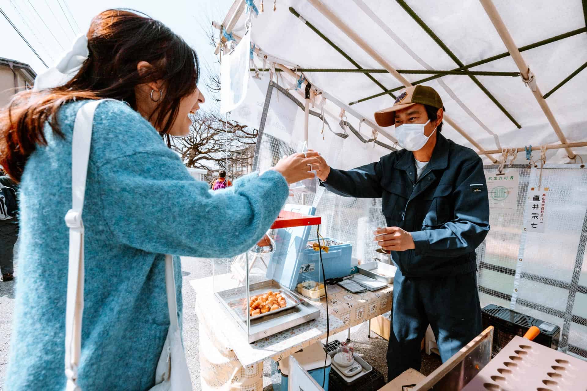 Purchasing snacks at Miyagawa Morning Market