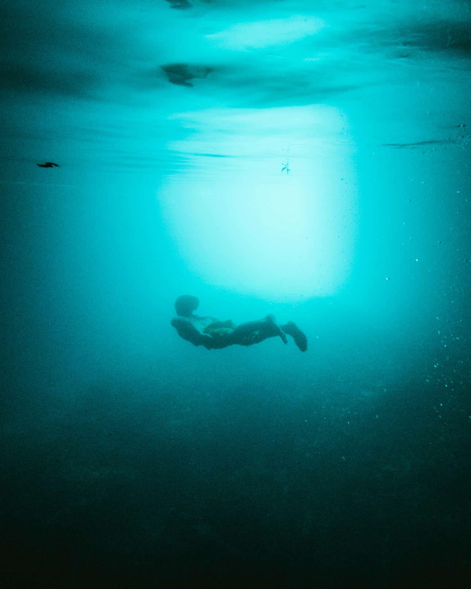 Swimming underwater in Cabagnow Cave Pool