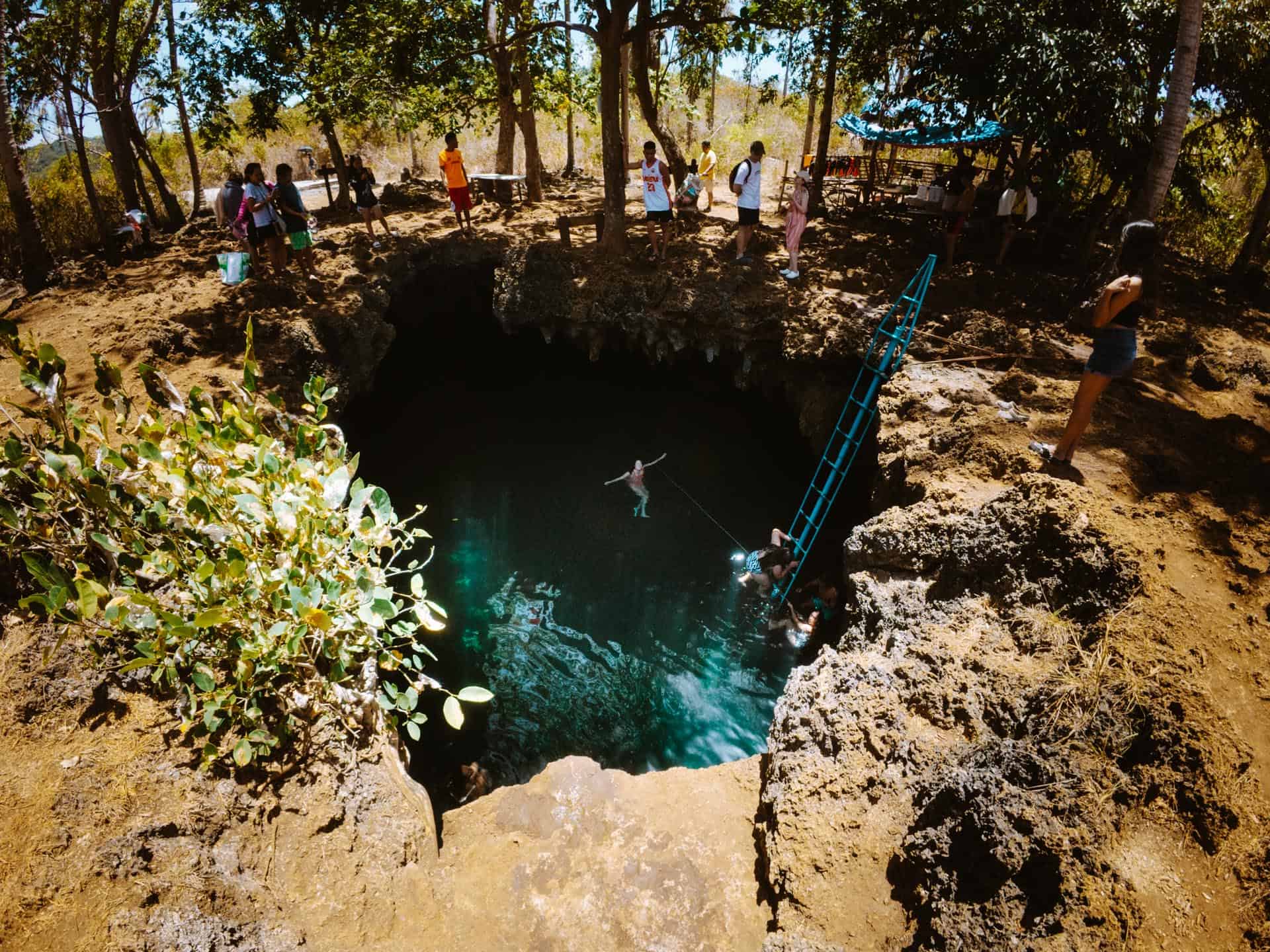 Woman inside of Cabagnow Cave Pool