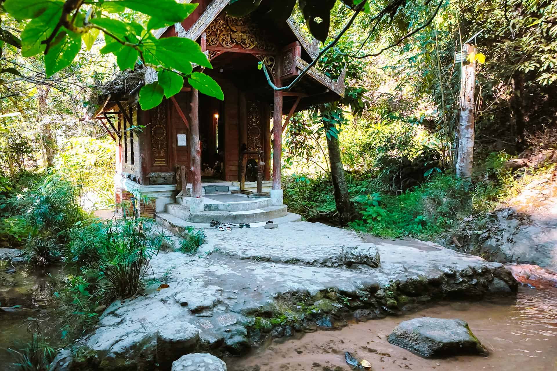 Mae Kampong Travel Guide: 6 Awesome Things to Do in Mae Kampong 7 Wat Khantha Phueksa ordination hall at river in Mae Kampong Thailand