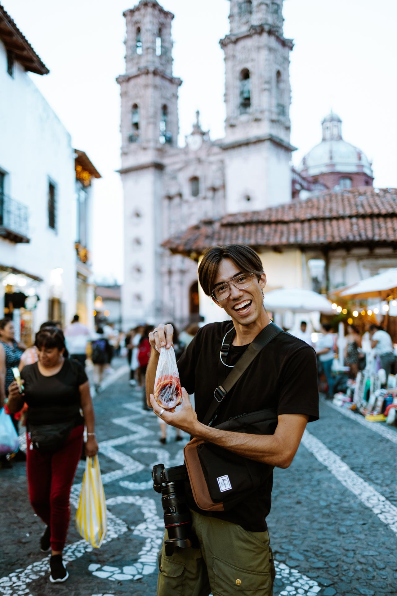 Trey with a pastry in the streets of Taxco