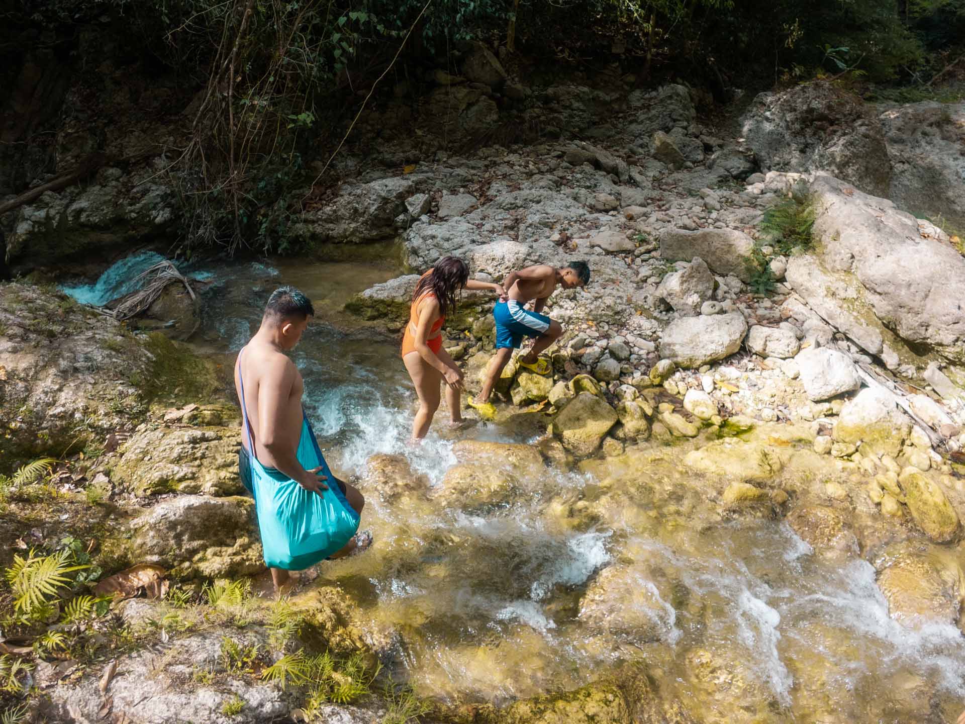 Dam Agan Falls in Bohol: Our Complete Guide 12 Crossing the stream to Ipo Falls in Bohol