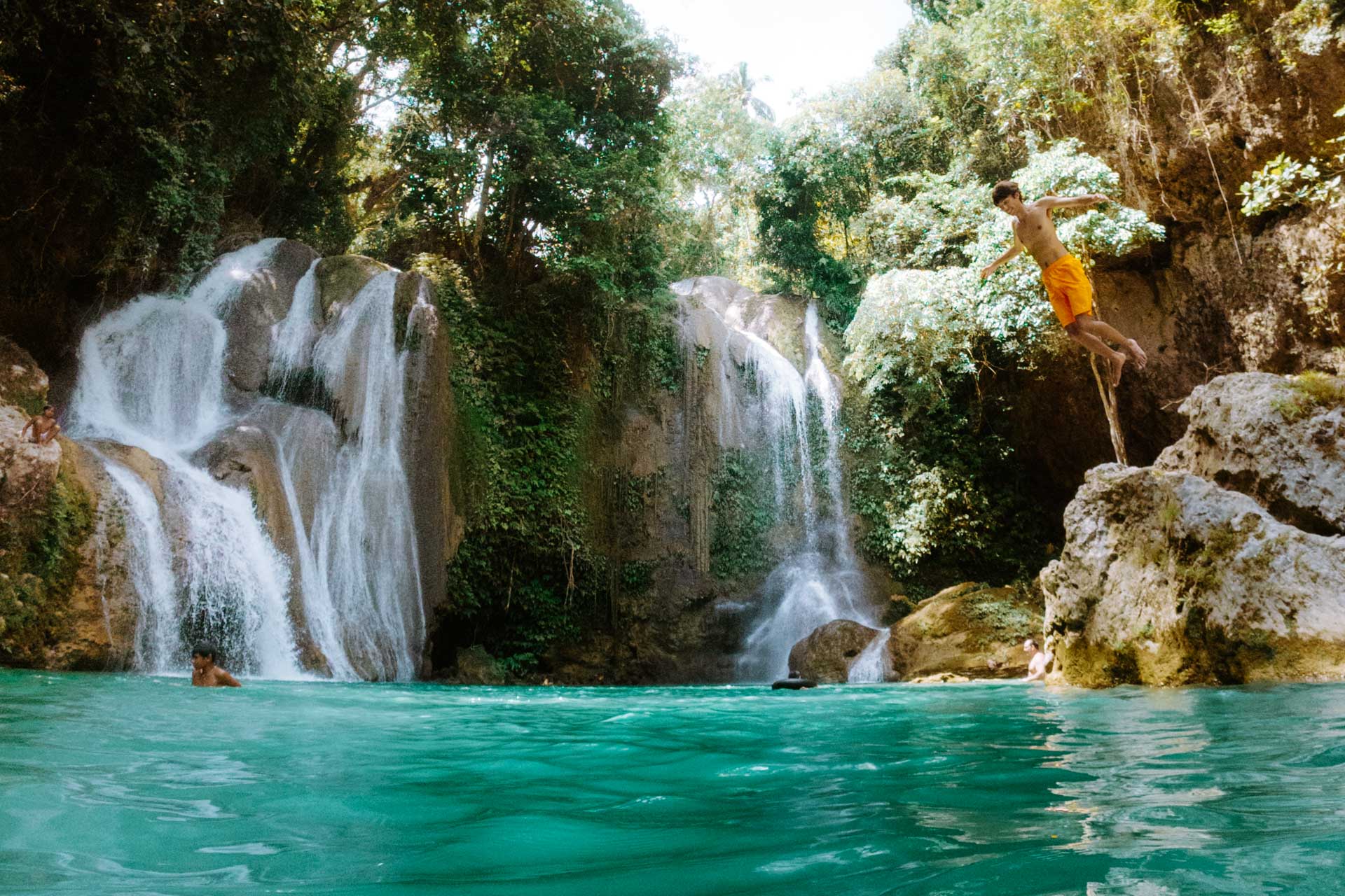 Jumping into pools at Pahangog Falls in Bohol