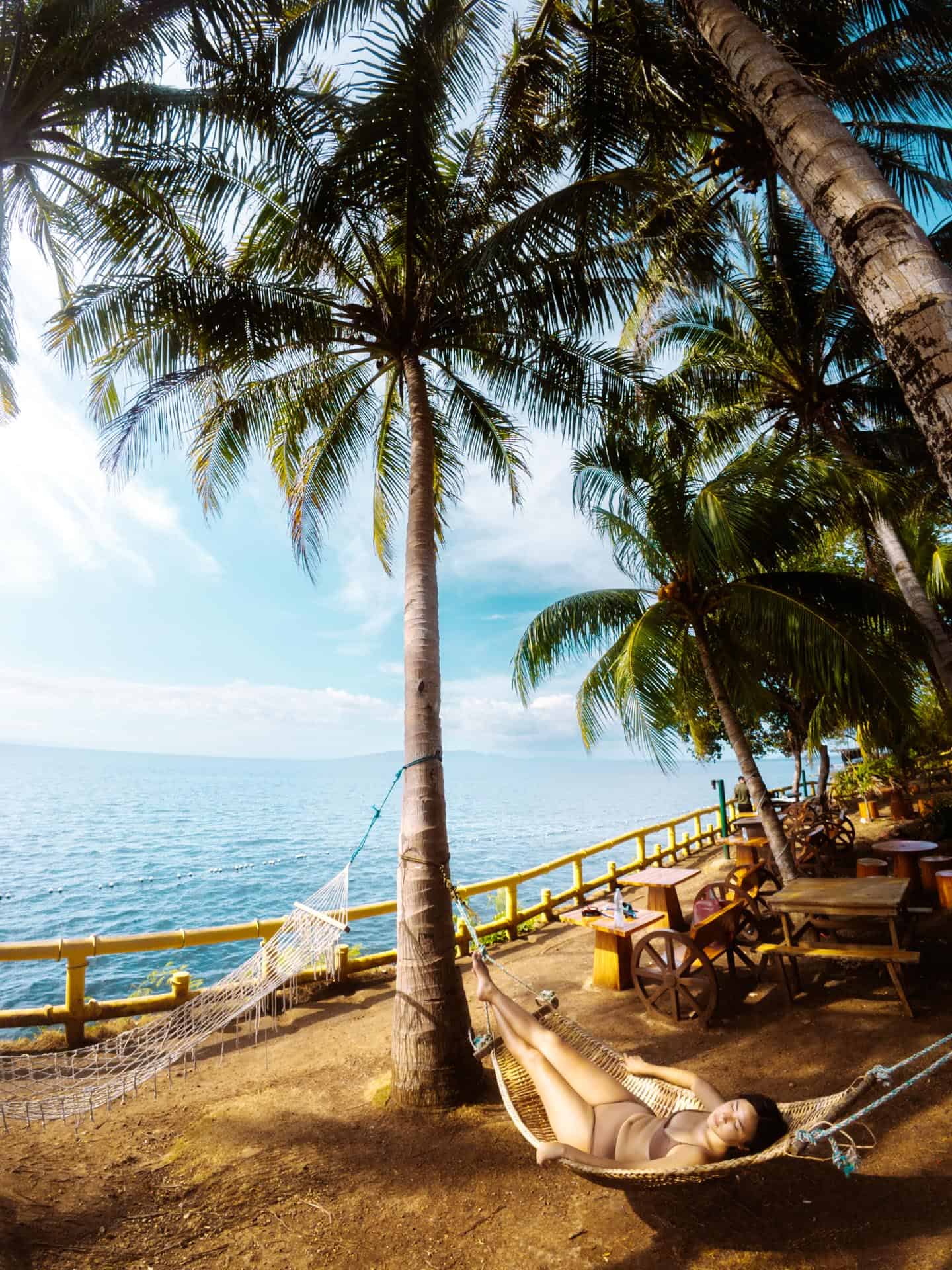 Relaxing on shore at Napaling Reef in Bohol