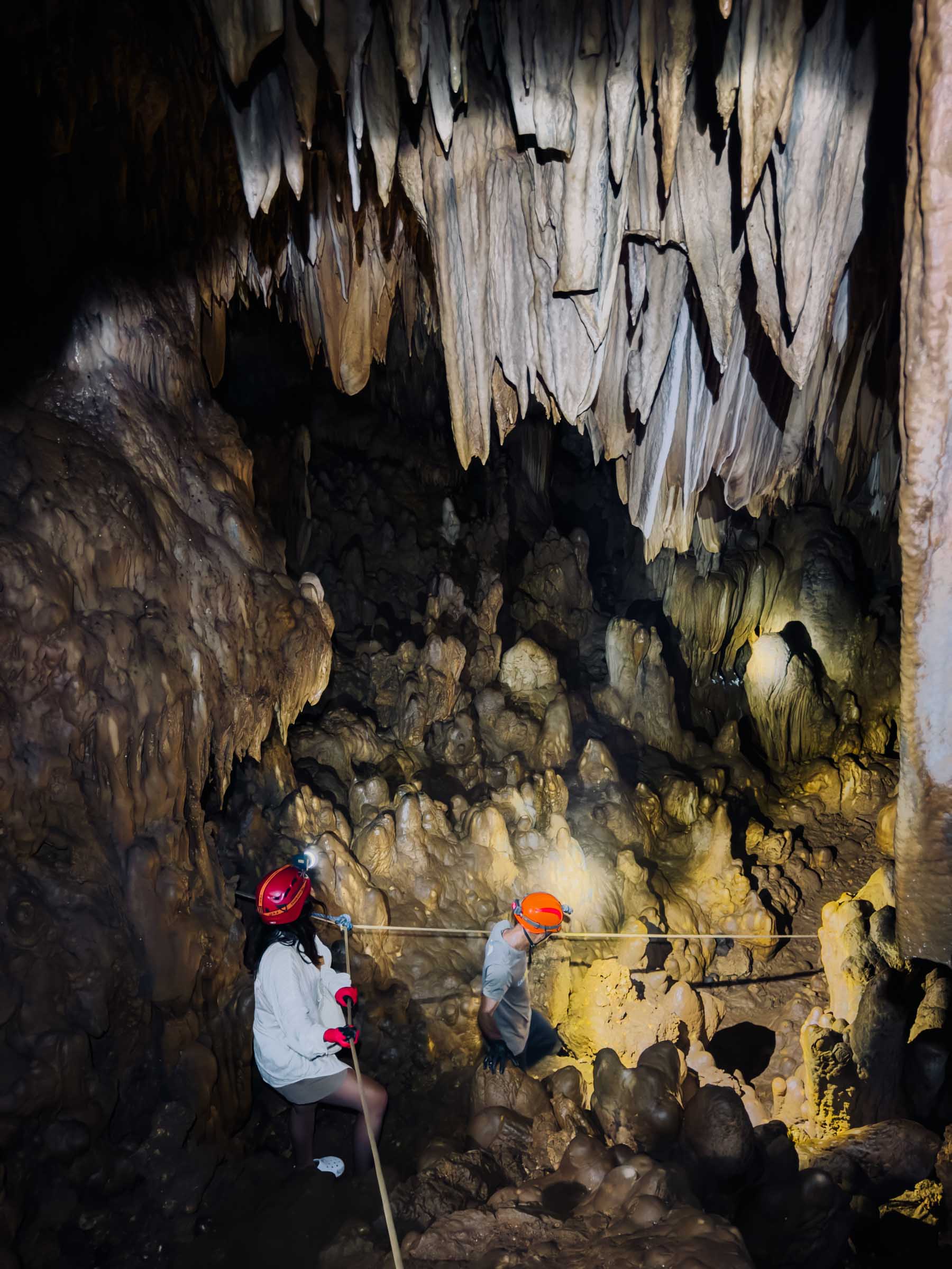 Climbing down into Somyot Cave in Siargao