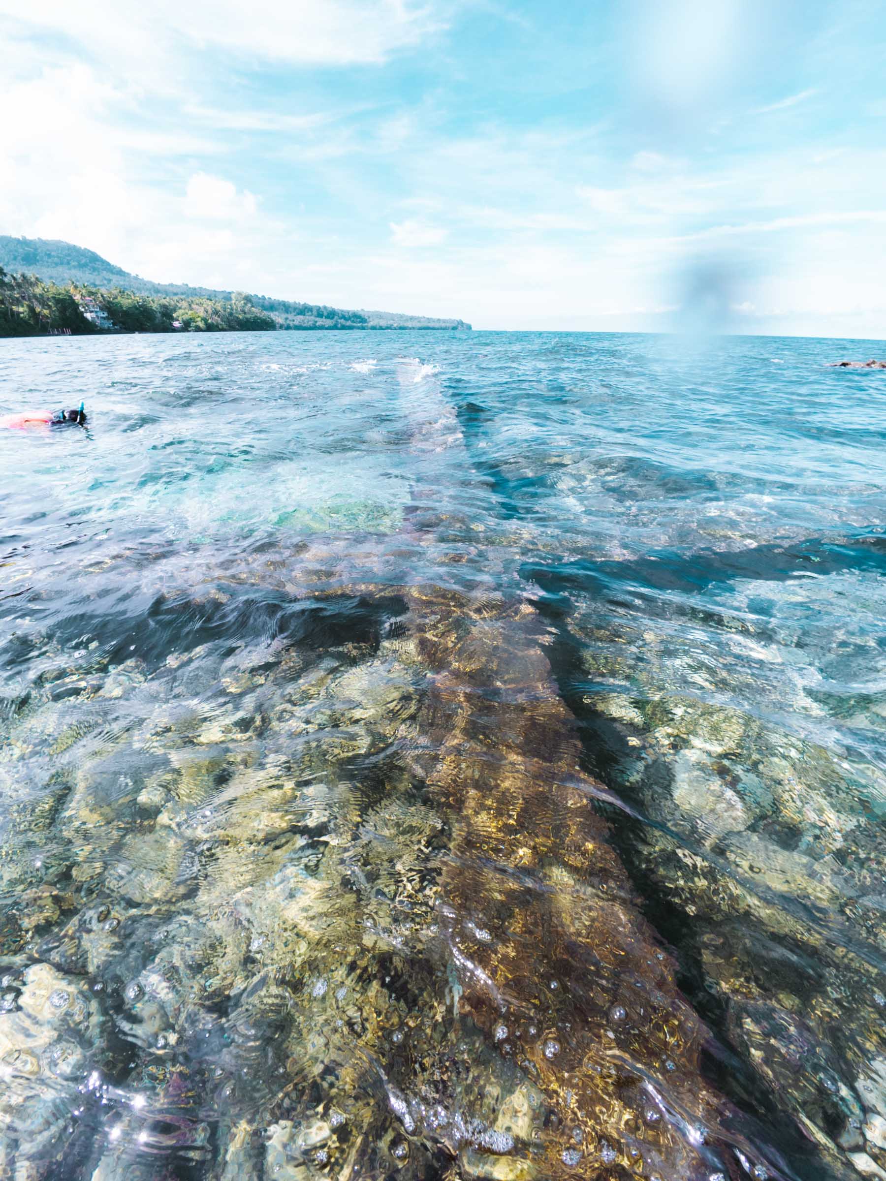 Old cross in water at Sunken Cemetery