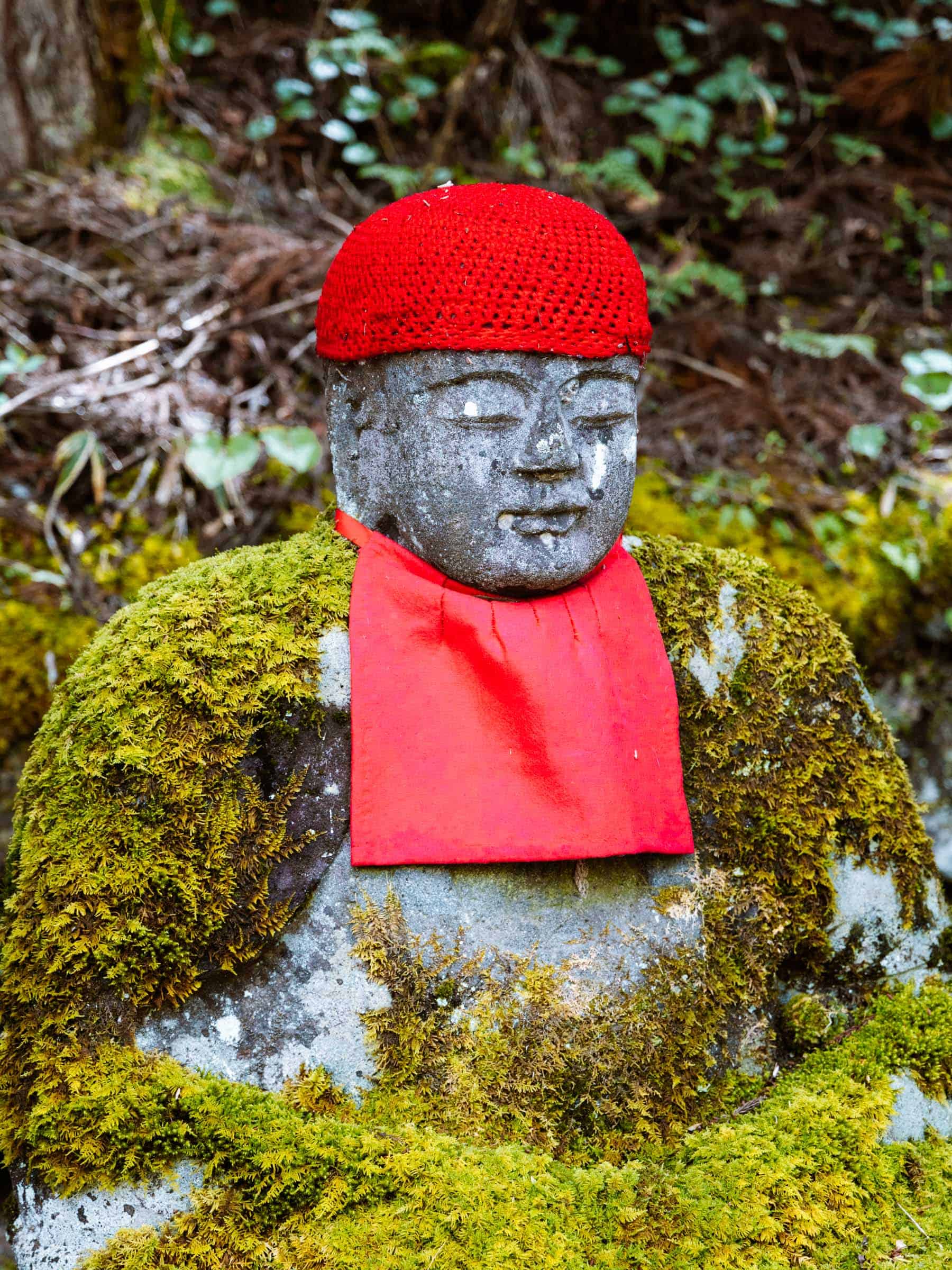 Kanmangafuchi Abyss in Nikko Budha with red hat