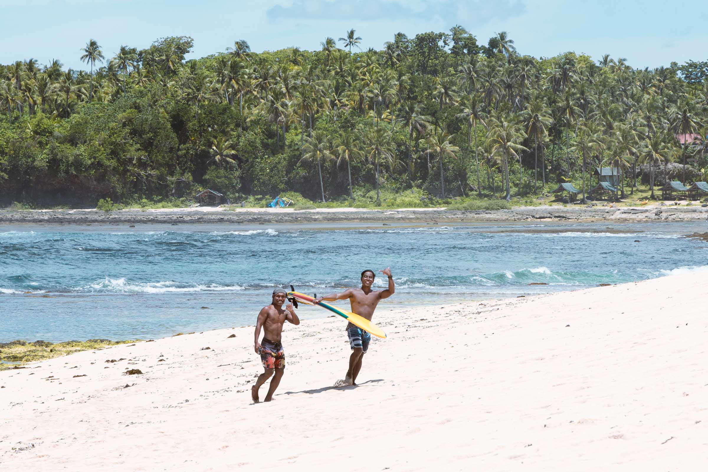 Surfers at Pacifico Beach Siargao
