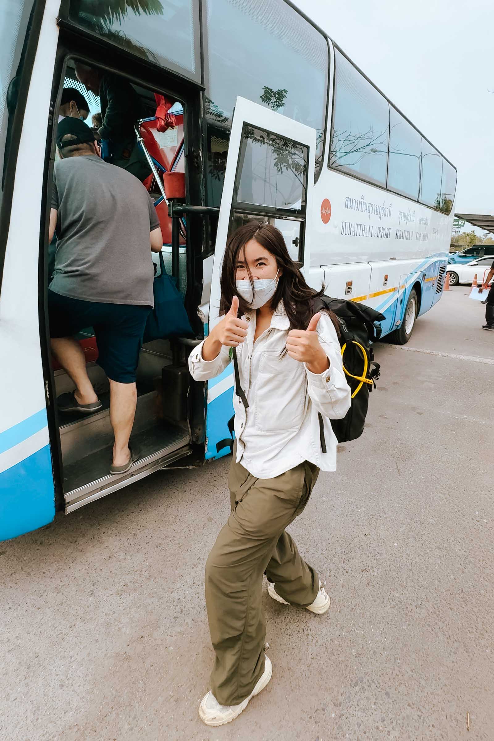 Chloe boarding the ferry transfer bus in Surat Thani