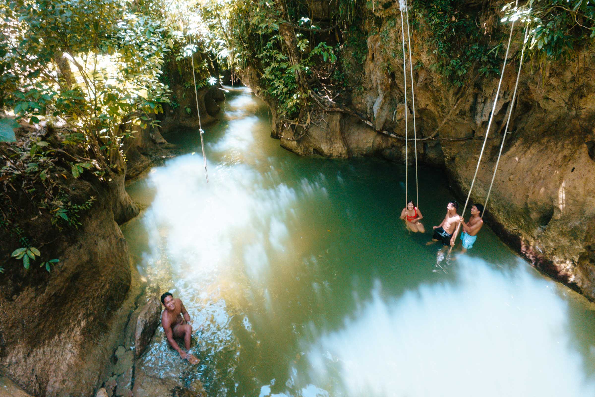 Tayangban Cave Pool locals and rope swings