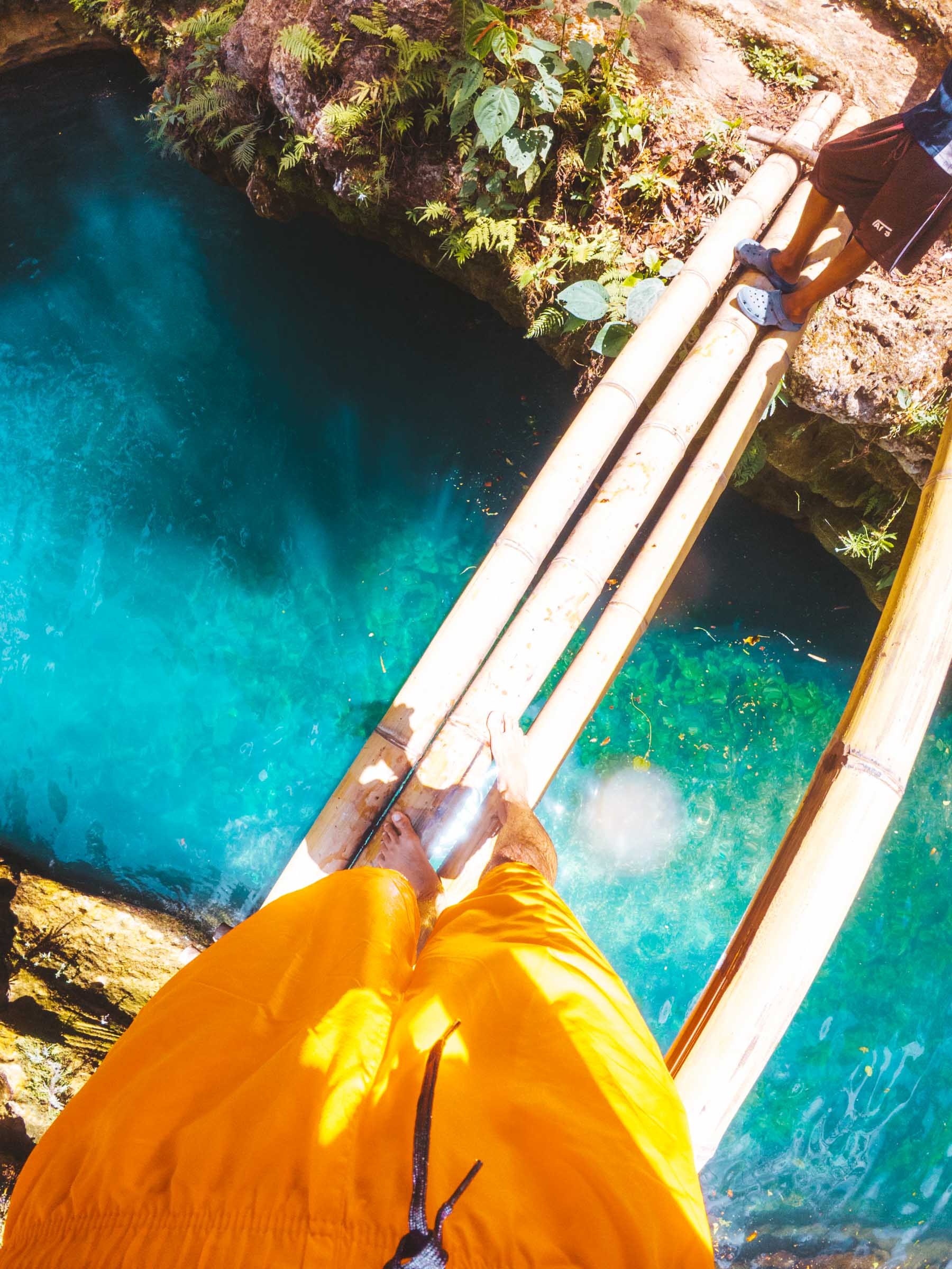 Where to Stay in Moalboal: Our Guide to the Best Areas and Hotels 49 Crossing bamboo bridge at Cancalanog Falls Cebu