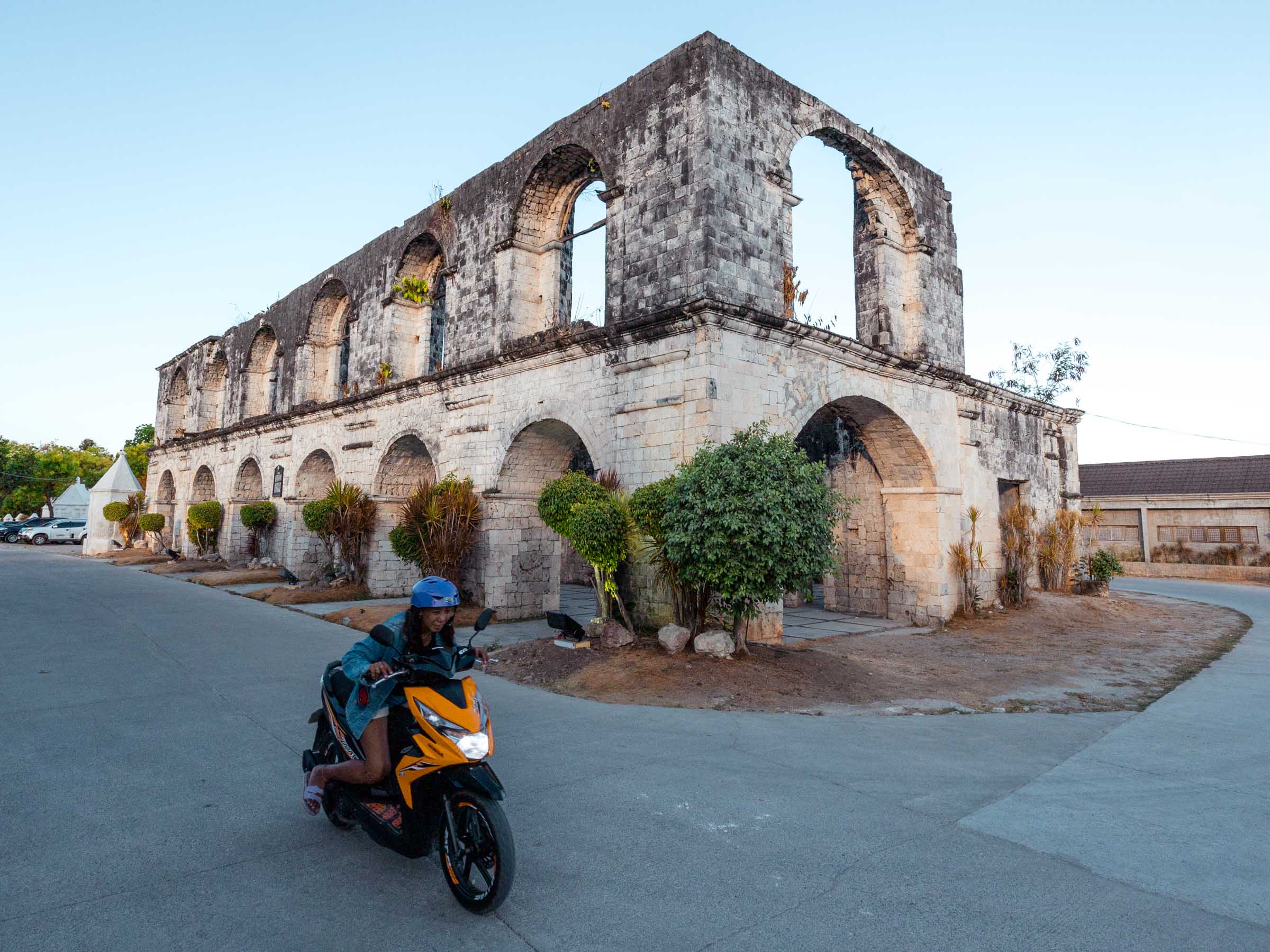 Motorbiker in front of Cuartel Ruins Oslob