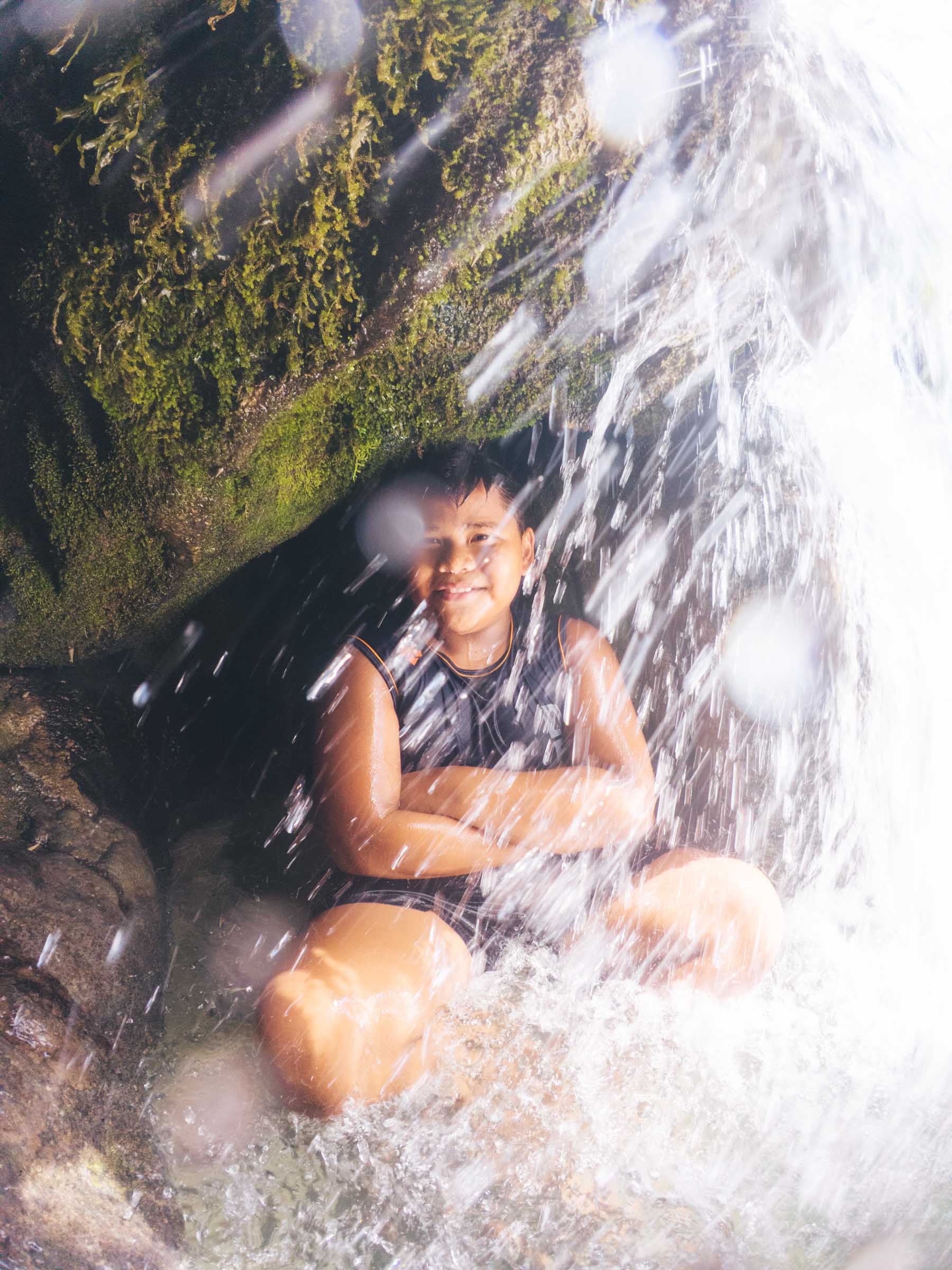 Inambakan Falls in Cebu: Complete Guide 14 Boy in secret cave at Inambakan Falls Cebu