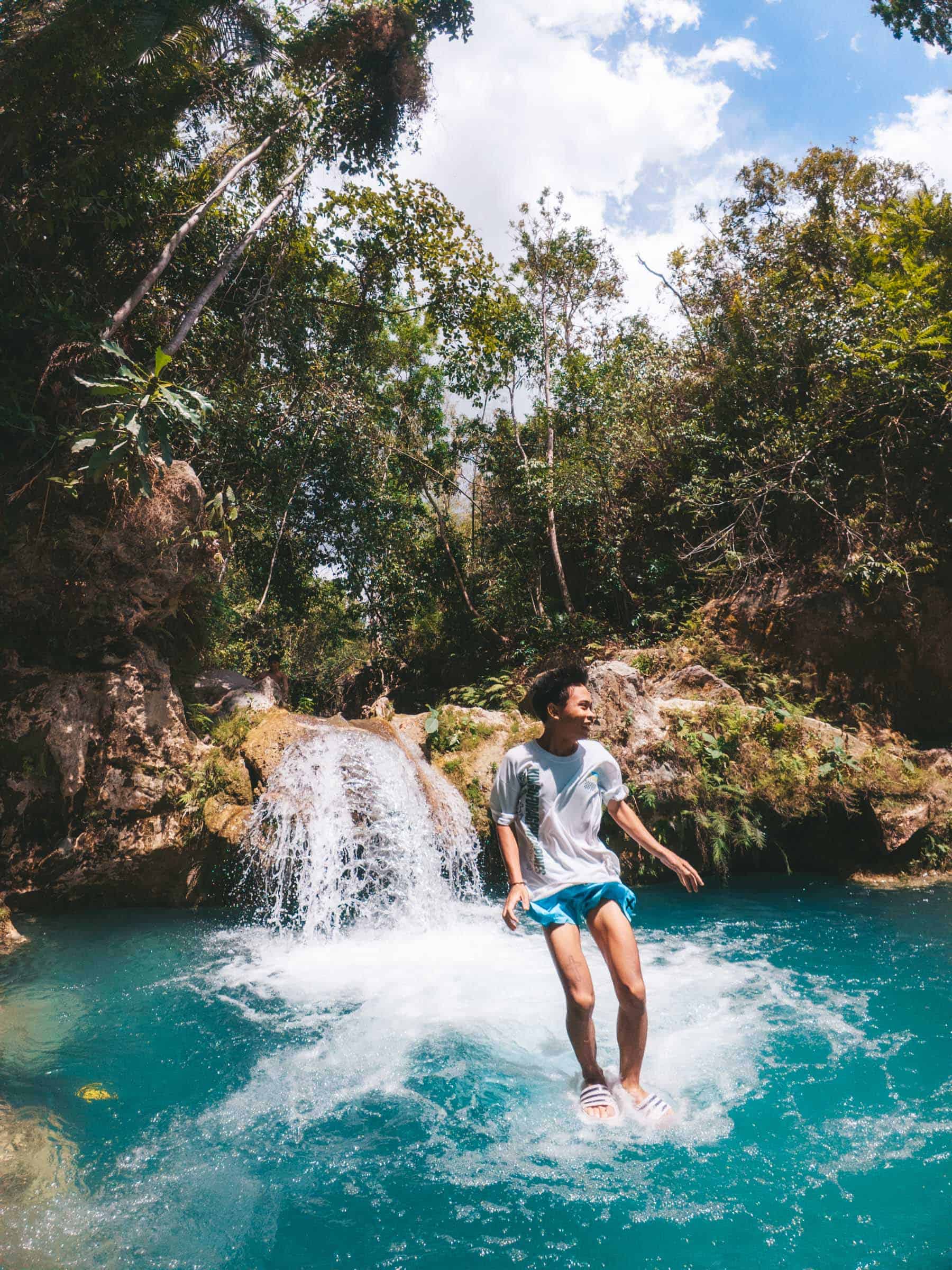 Inambakan Falls in Cebu: Complete Guide 12 Local jumping into water at Inambakan Falls Cebu