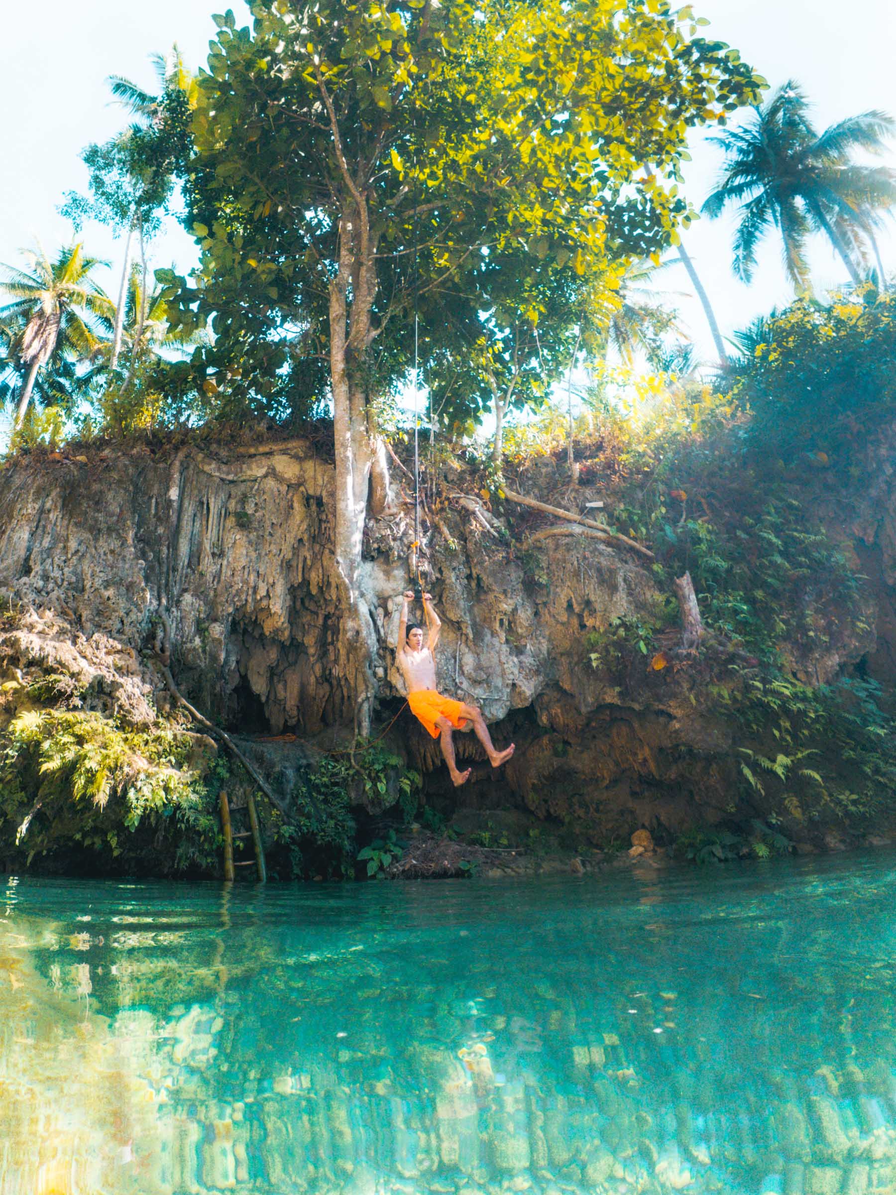 man on rope swing kanlaob falls cebu