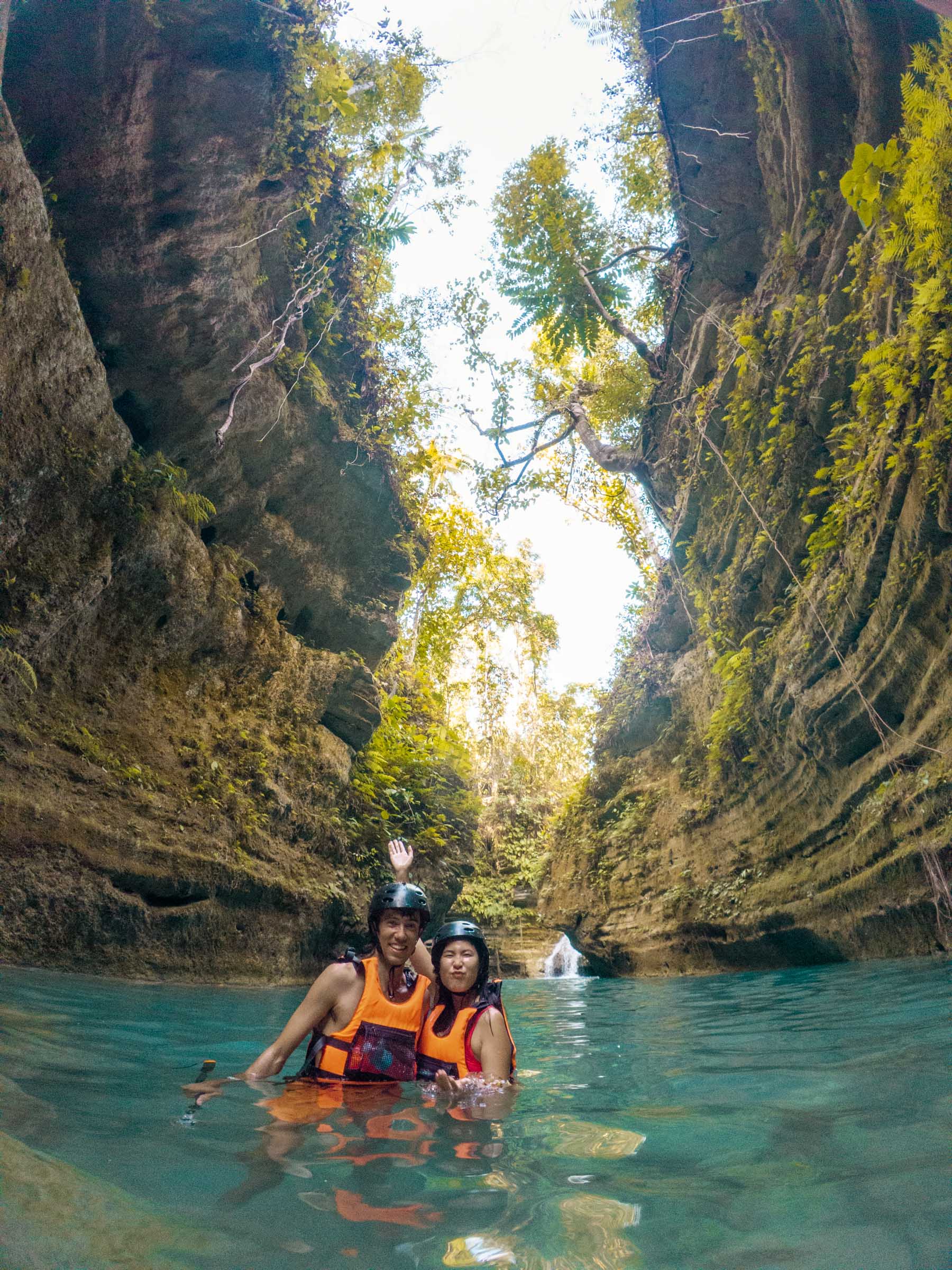 Kawasan Falls Canyoneering: Complete Guide 31 Chloe and Trey in canyon at Kawasan Falls Canyoneering