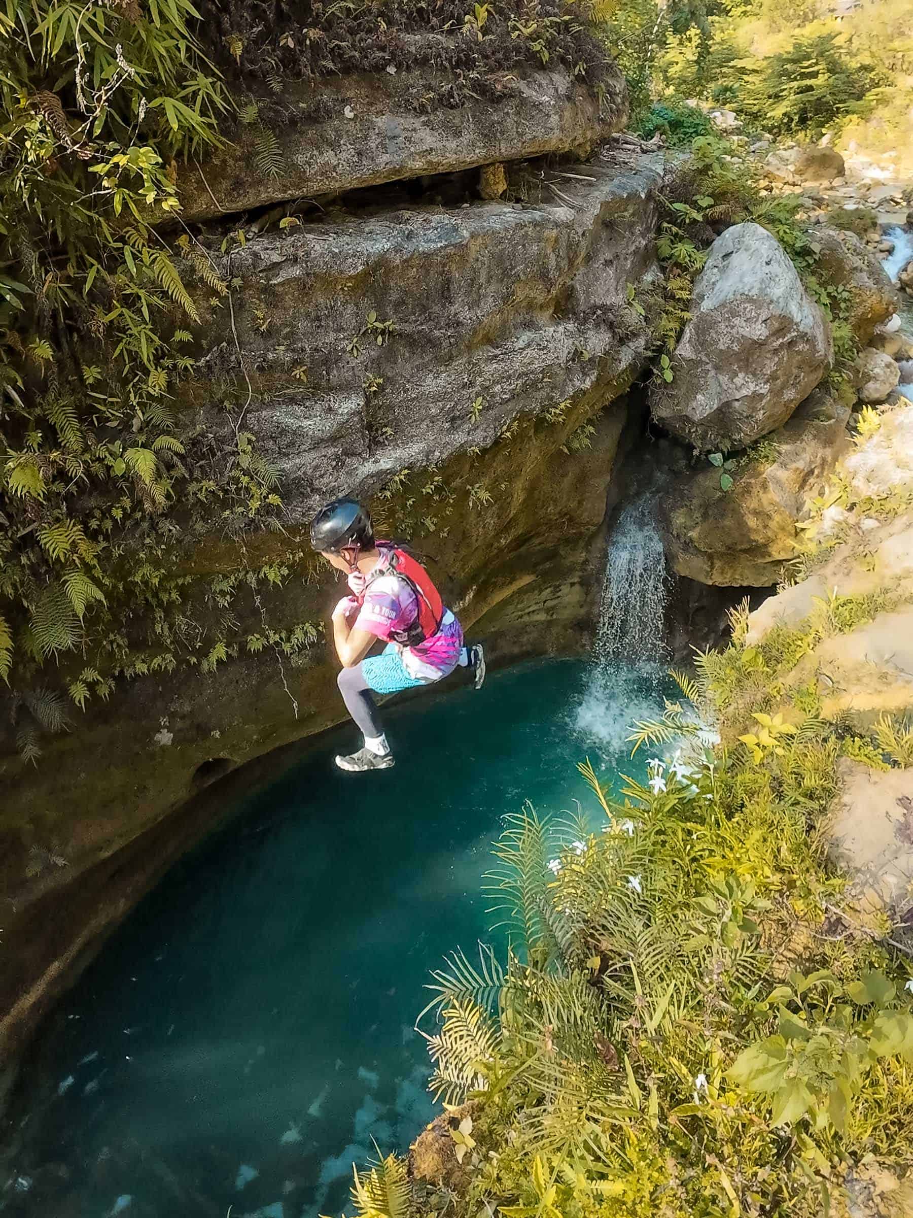 Kawasan Falls Canyoneering: Complete Guide 4 Tour guide jumping in Kawasan Falls Canyoneering