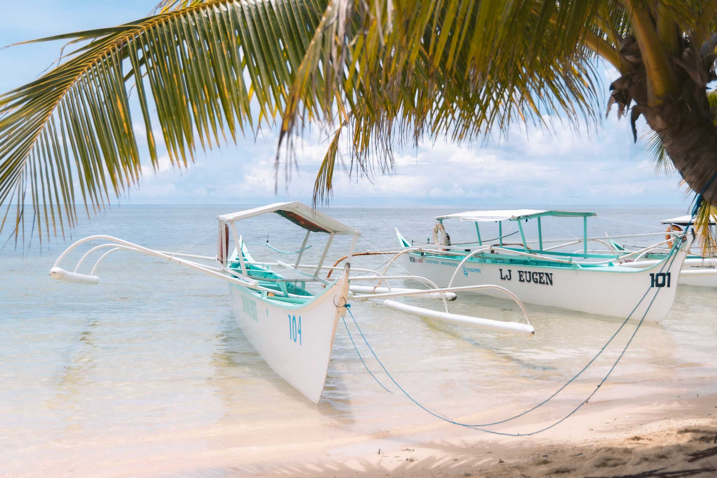 Pamomoan Beach in Siargao: Complete Guide 2 Boats at Pamomoan Beach Siargao