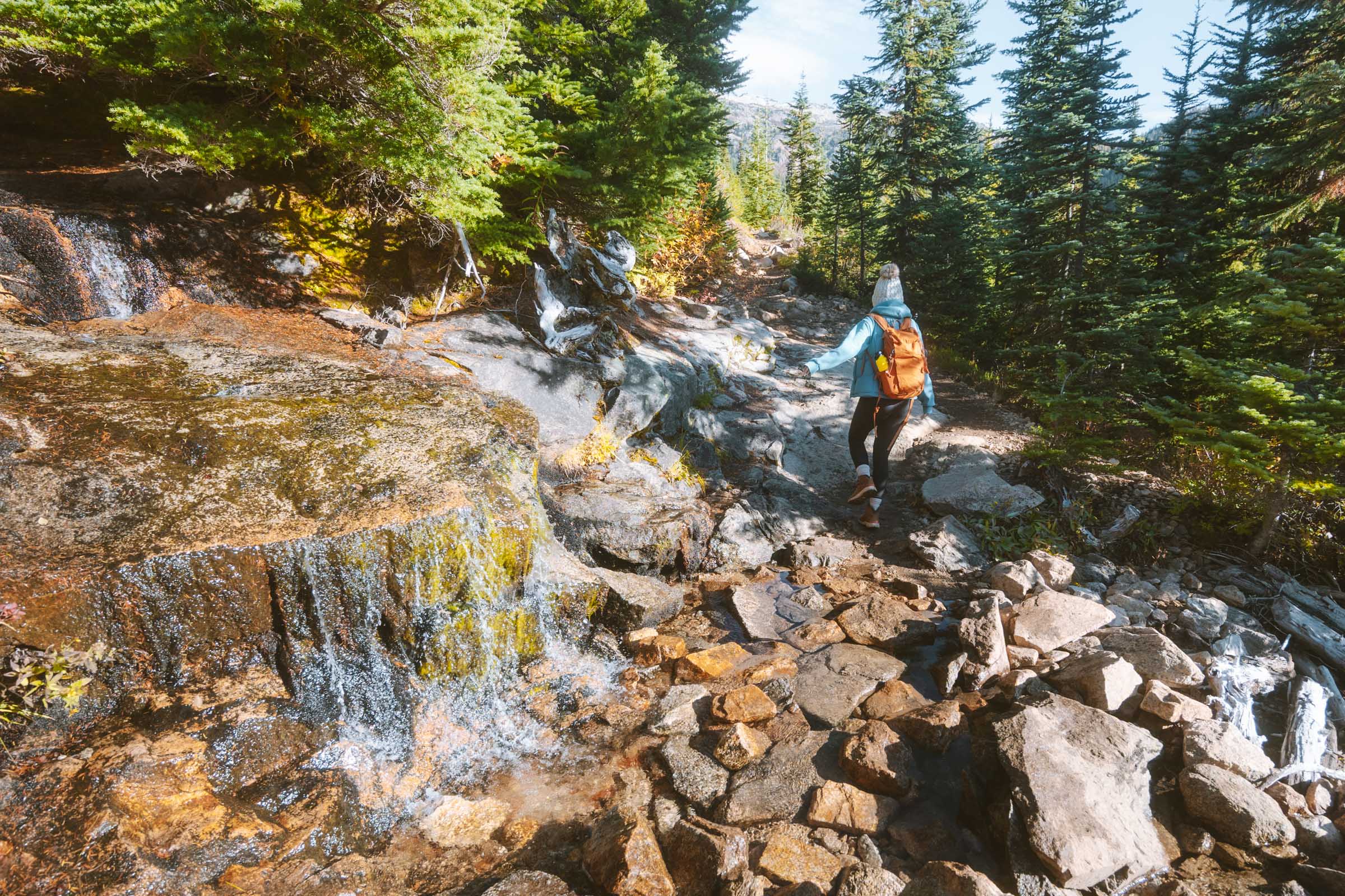 Hiking through creek crossing to Cutthroat Pass