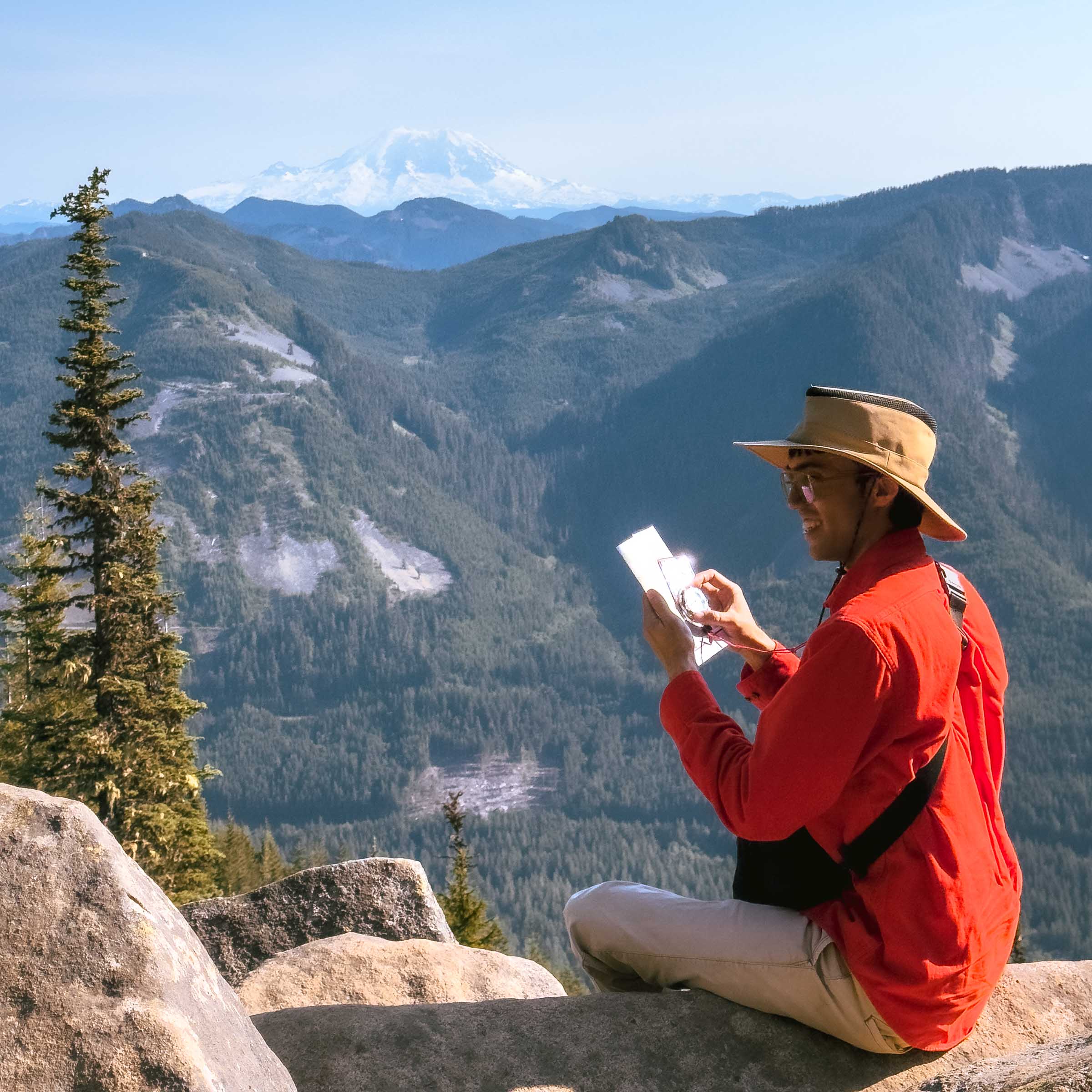 Trey using compass at Ira Spring Lookout near Mason Lake