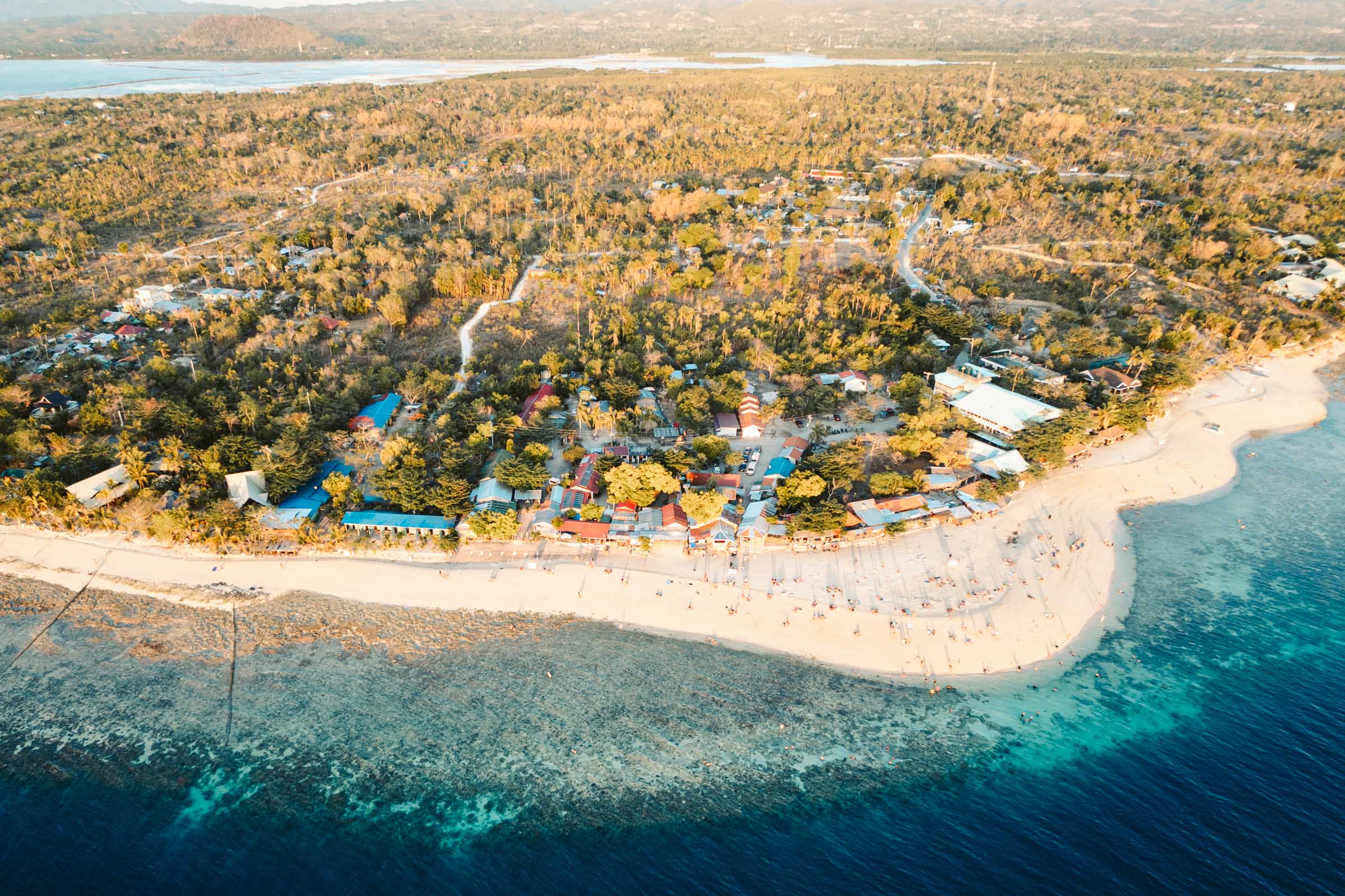 Where to Stay in Moalboal: Our Guide to the Best Areas and Hotels 6 white beach moalboal aerial view